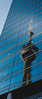 Reflection of the CN tower on a glass skyscraper.