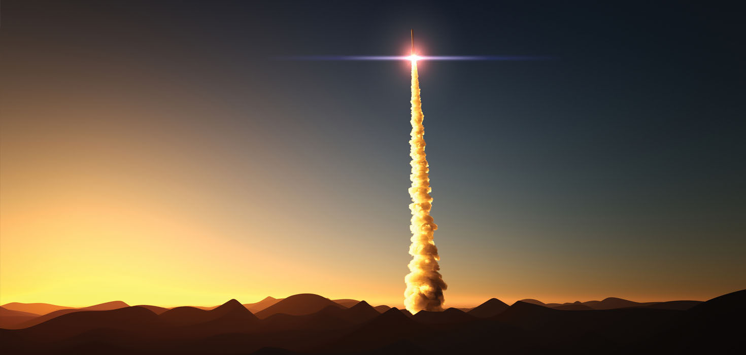 Spaceship taking off during sunrise.