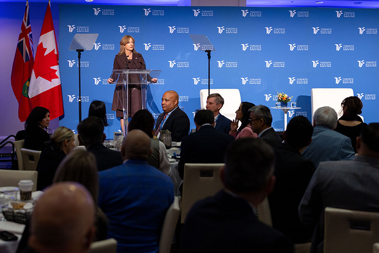 A woman speaks at a podium