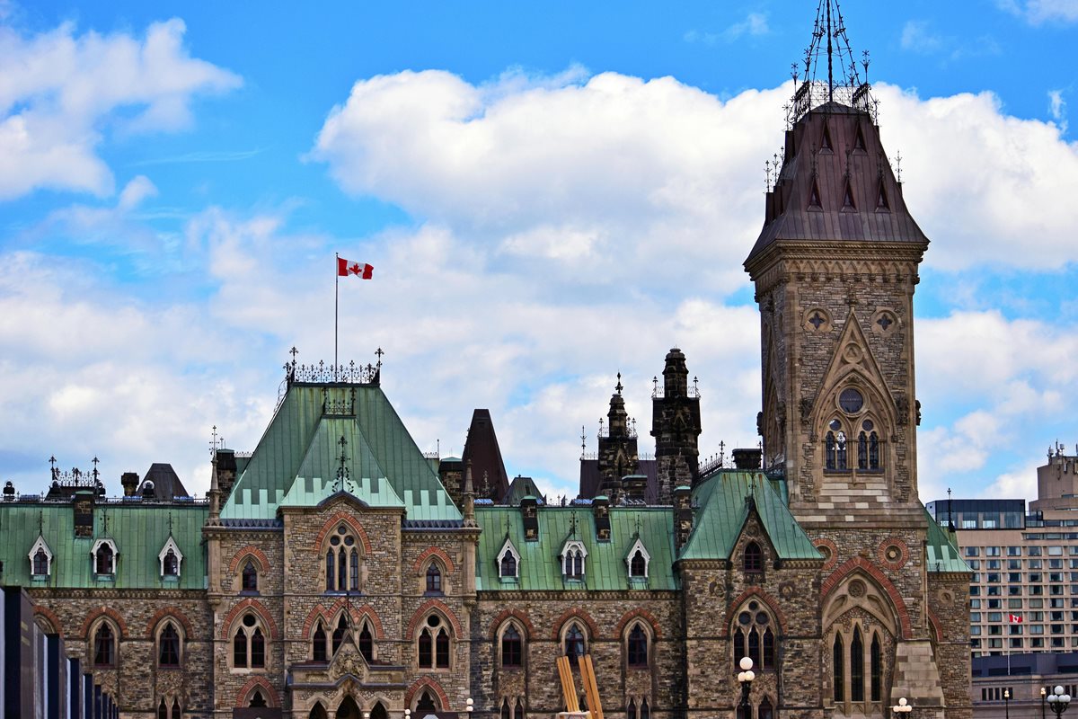 Ottawa's Parliament hill, on the back of a blue sky.