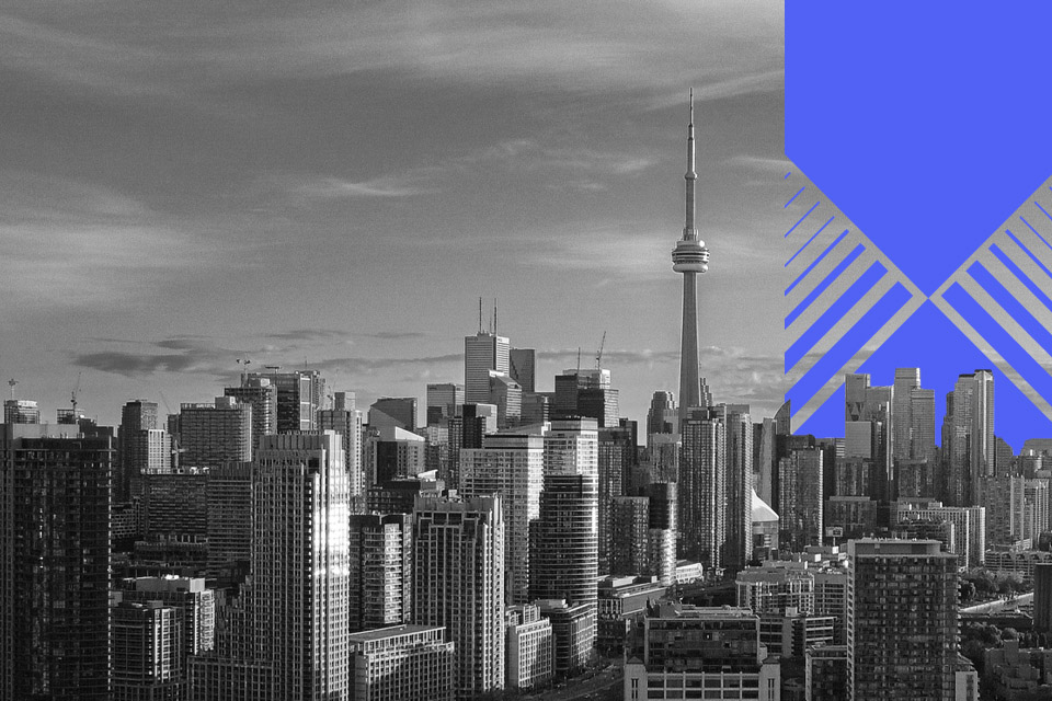 A greyscale photo of Toronto with a blue designed element on the right-hand side.