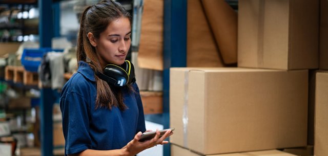 Inventory worker checking a package.