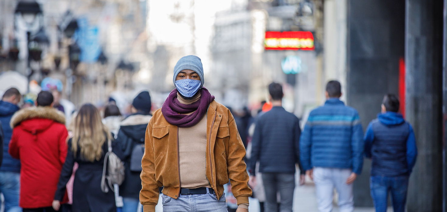 Man in winter clothes wearing mask
