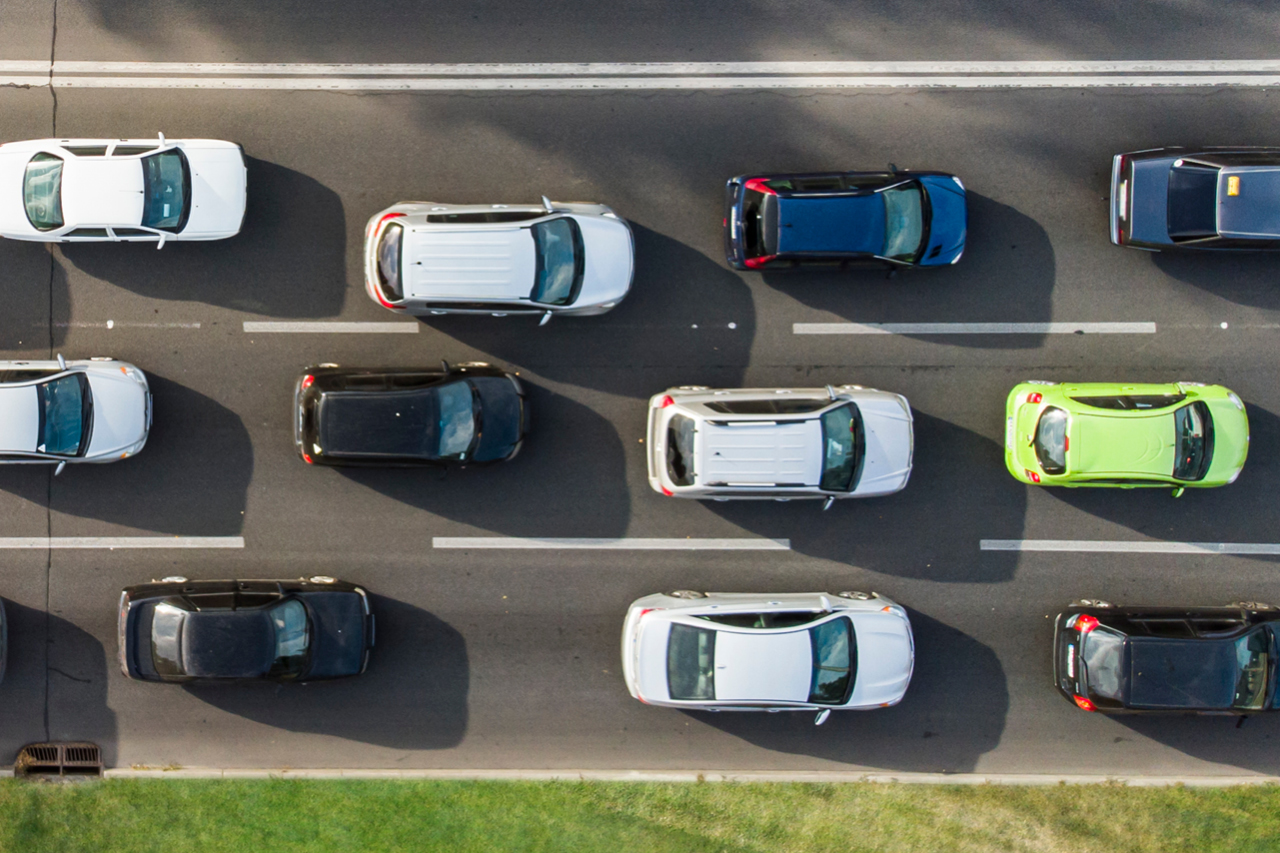 Bird's eye view of traffic gridlock on a three-lane highway.