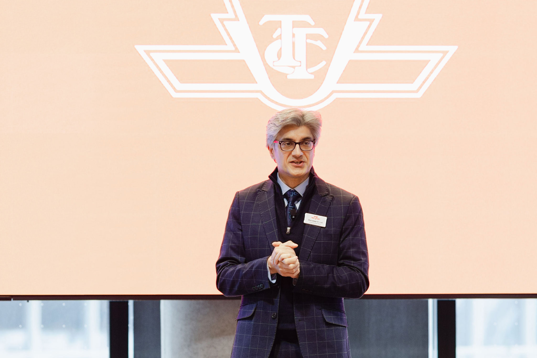 TTC CEO Mandeep S. Lali speaks on stage during the Transforming Transit in Toronto event, outlining his vision for transit reliability and safety in the Toronto region.