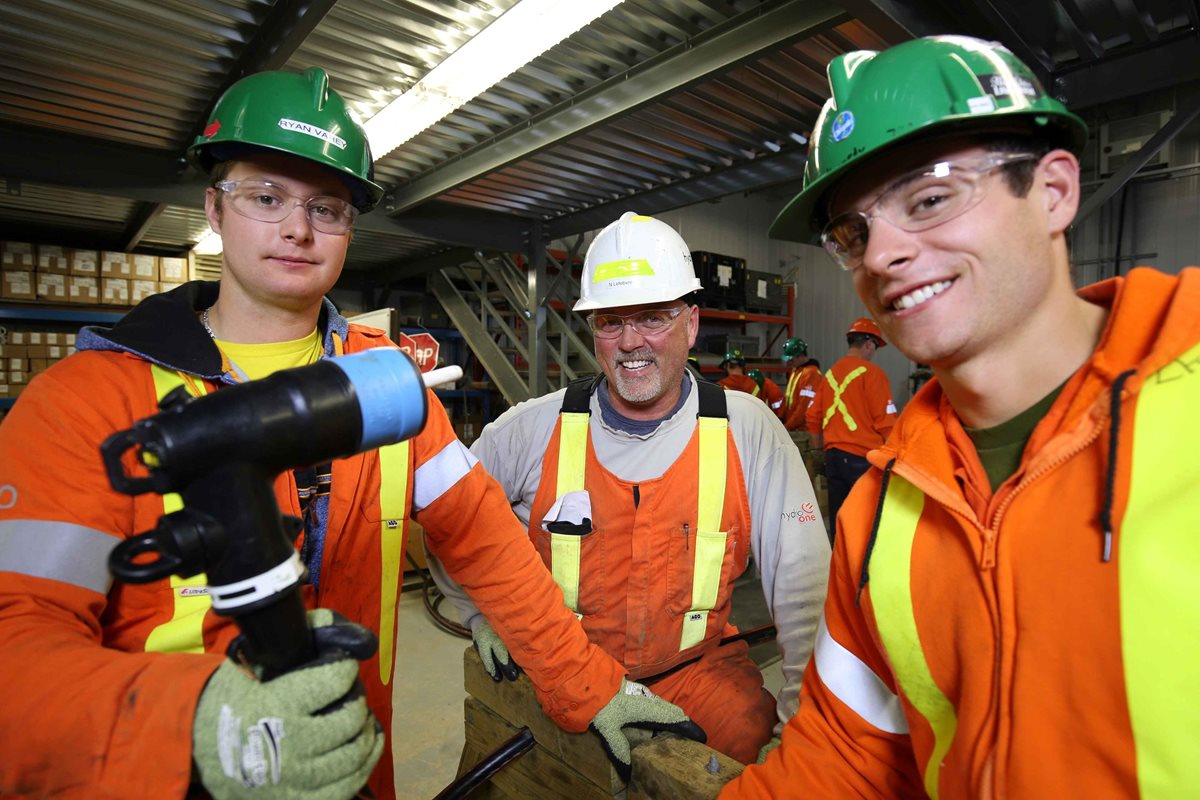 A group of young power workers in protective gear. 