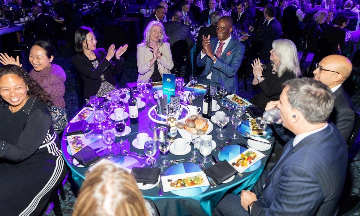 A group of people clapping from the 2023 Annual Dinner.