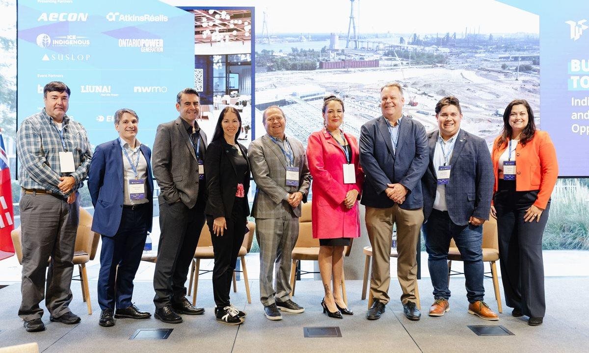 A group of people standing on the stage at our Indigenous Business Summit.