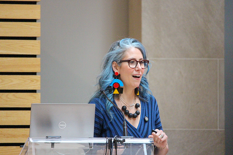 Emma Aiken-Klar, Academic Director of the Rotman Business Design Initiative, addresses the room.