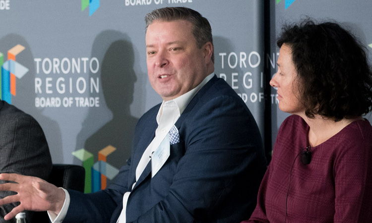 Man and woman panelists speaking at Toronto Region Board of Trade event.