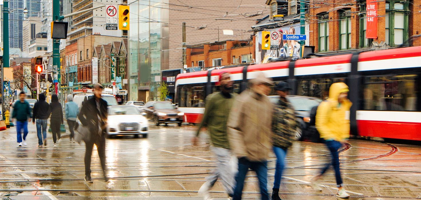 People using crosswalk in Toronto