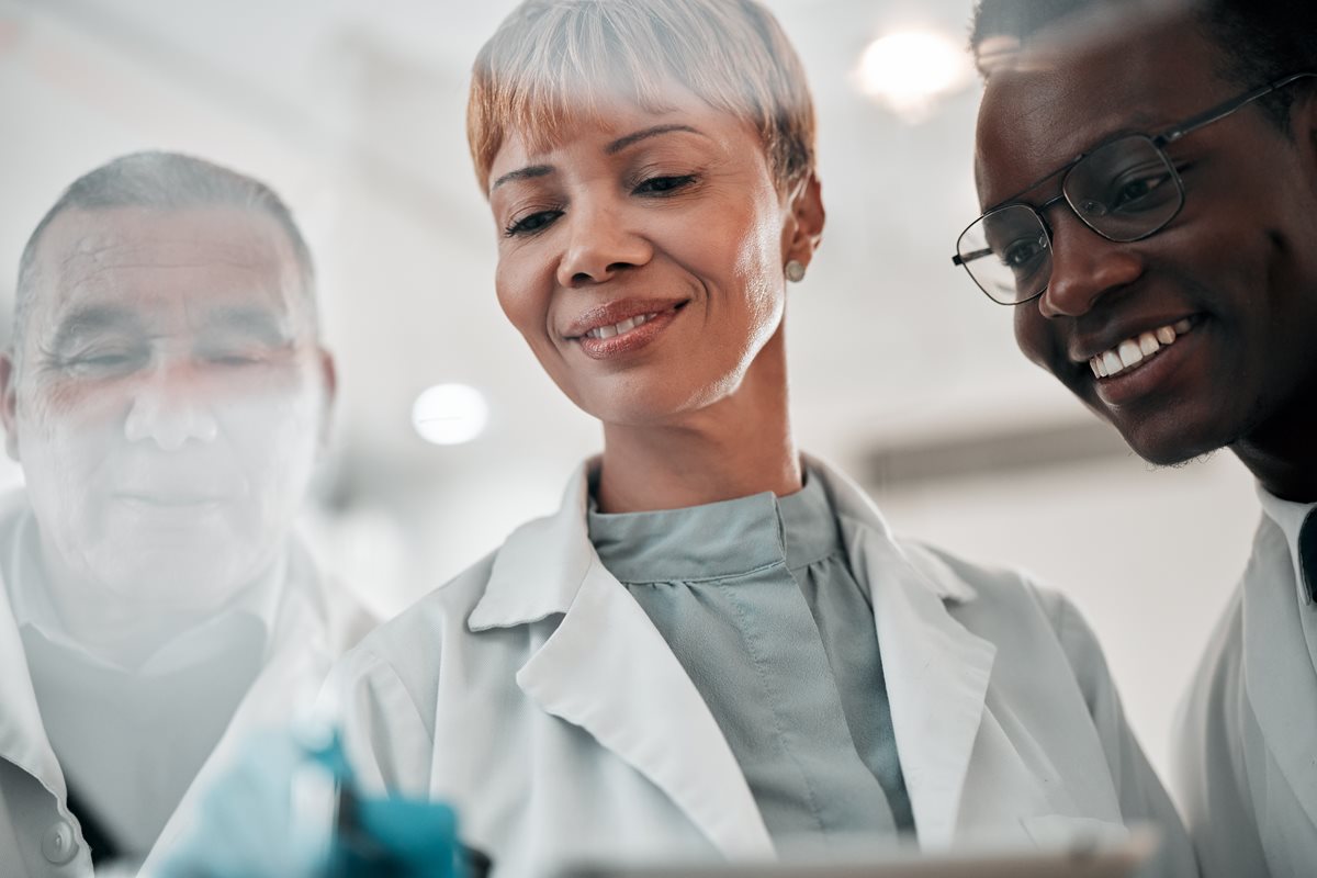Researchers looking at pipette.