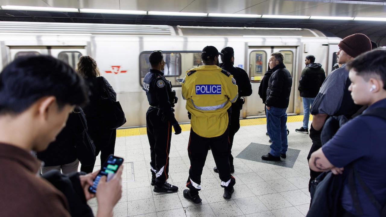 Police discussing a matter on the TTC.
