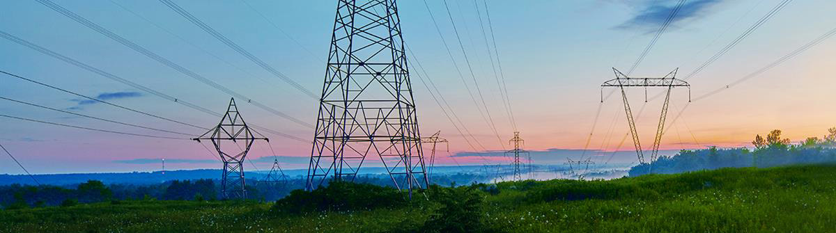 Transmission towers during a sunset
