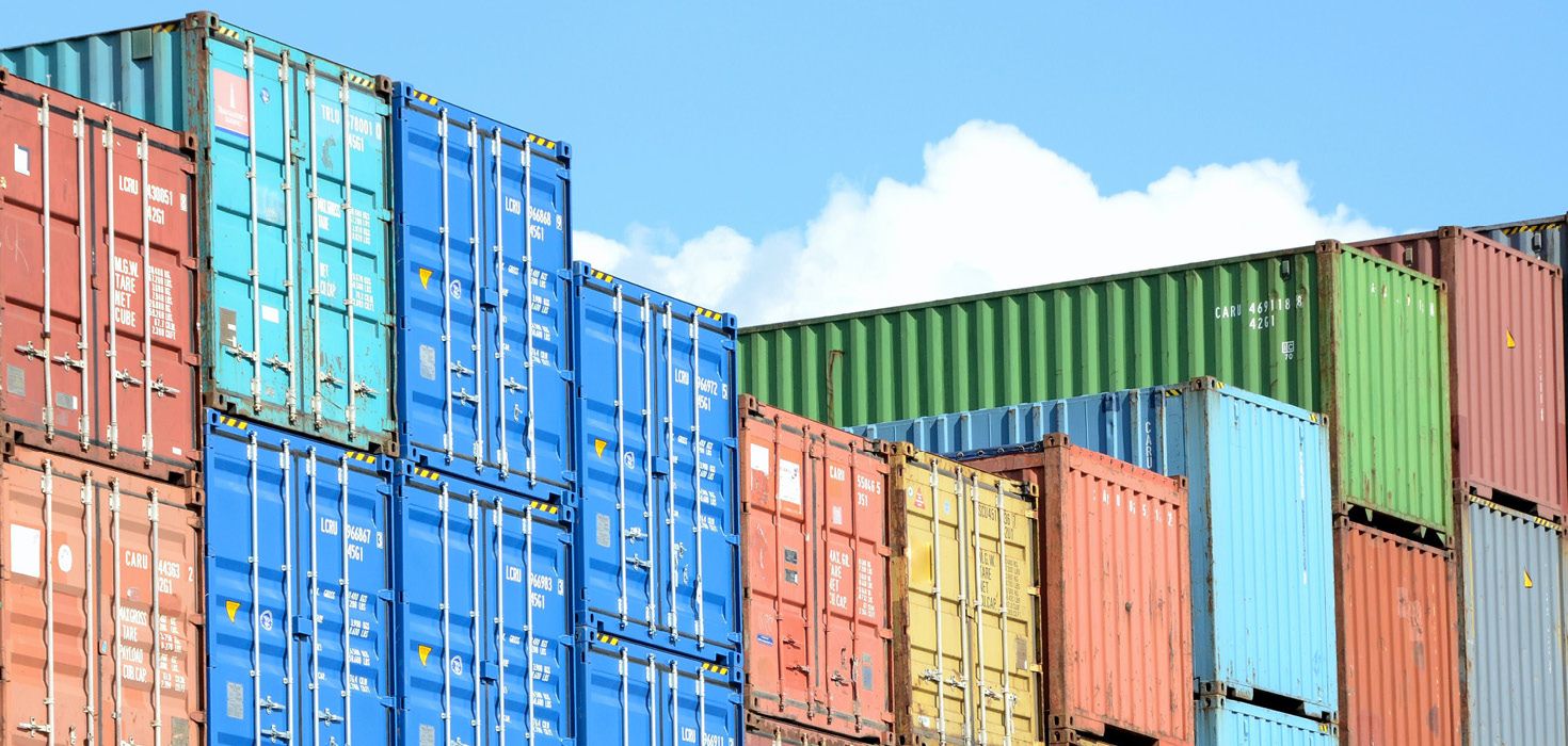 A view of colourful, stacked shipping containers. 