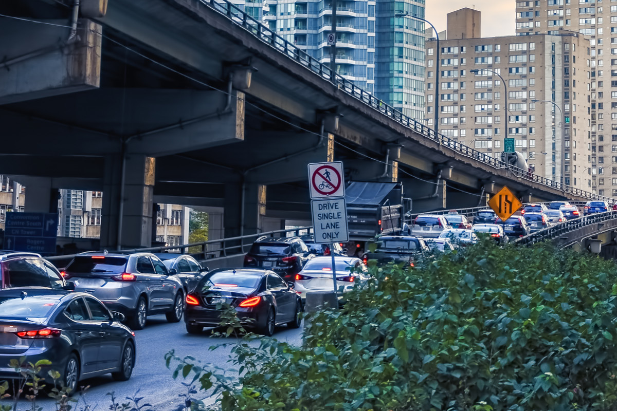 A lineup of cars waiting to merge onto the Gardiner.
