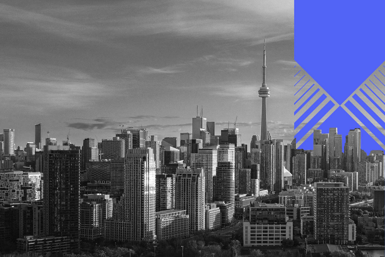 A greyscale photo of Toronto with a blue designed element on the right-hand side.