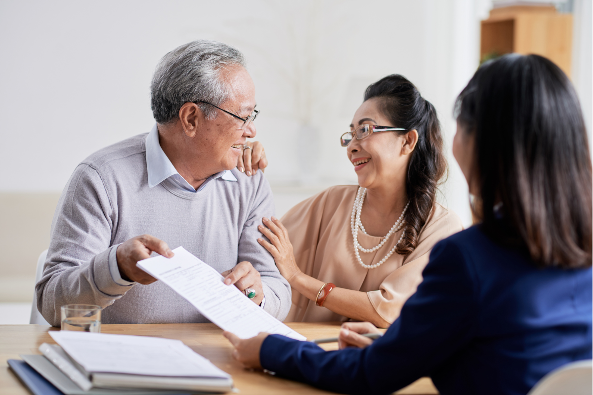 An elderly couple estate planning together.