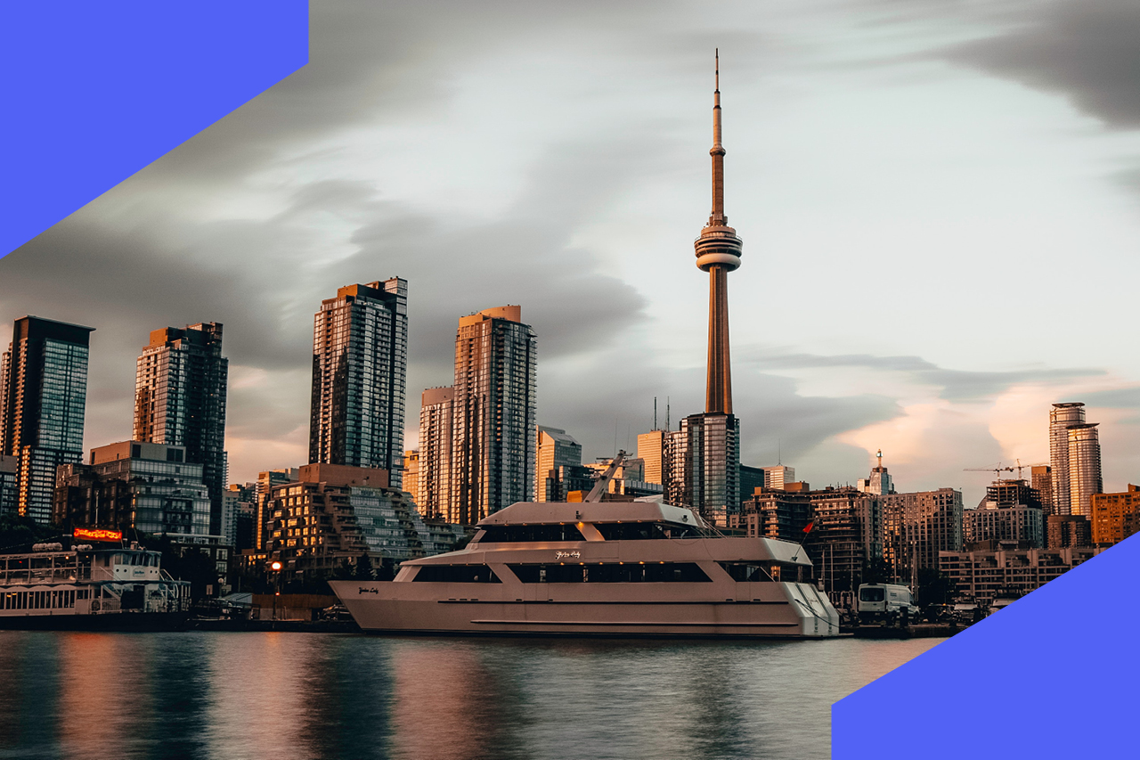 A photo of the Toronto waterfront admist a dark sky.