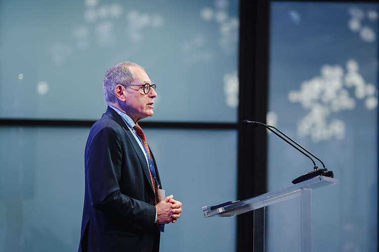 Giles Gershon speaks at a podium