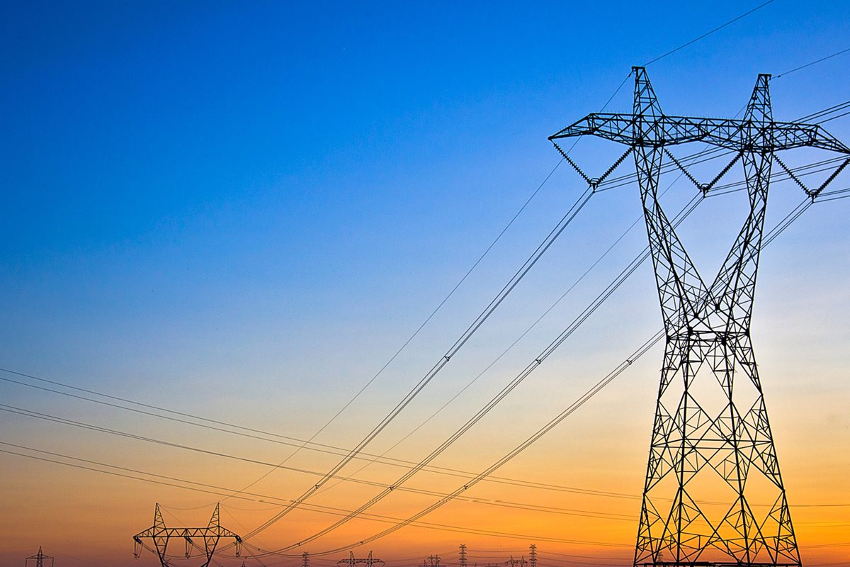 Power lines on a sunsetting sky.